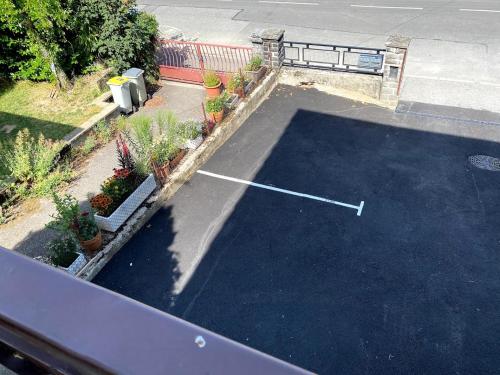 an aerial view of a parking lot with plants at L'Industriel in Thonon-les-Bains