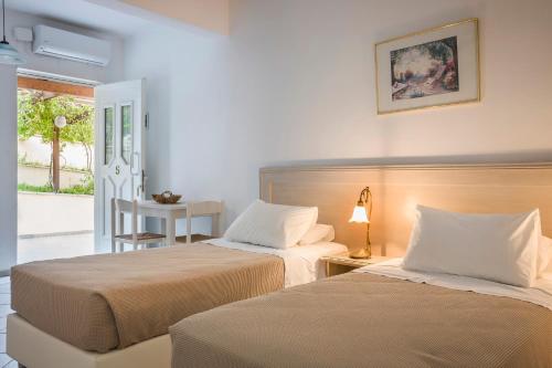 Posteľ alebo postele v izbe v ubytovaní Panorama Apartments Fiscardo