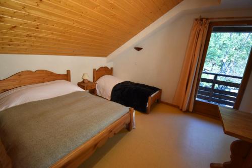 מיטה או מיטות בחדר ב-VAUJANYLOCATIONS - Les Balcons de Vaujany