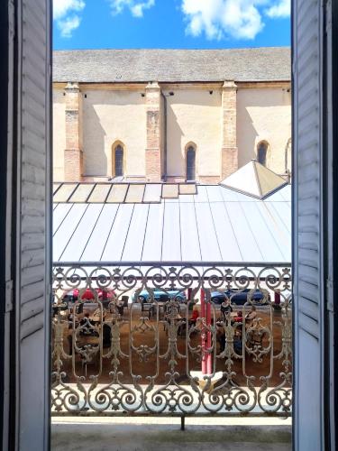 a view from a window of a building with cars parked at Joli duplex avec balcon et vue sur place du centre historique ! in Foix