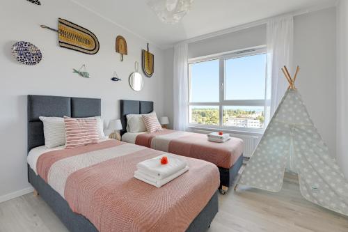 Posteľ alebo postele v izbe v ubytovaní Baltica SeaView by TriApart