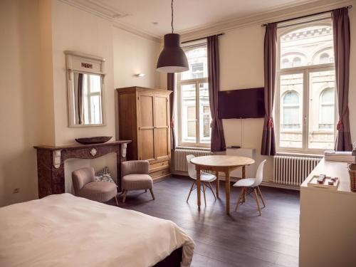 Postel nebo postele na pokoji v ubytování Maison Willem Tell