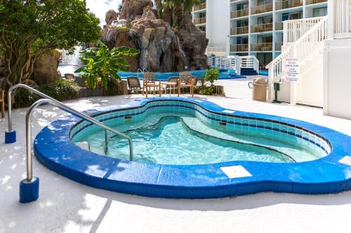 a swimming pool in the middle of a building at The Island Resort at Fort Walton Beach in Fort Walton Beach