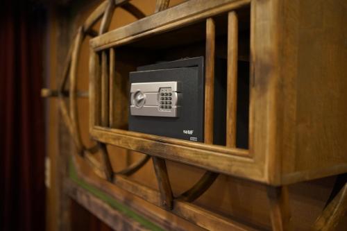 a wooden cabinet with a box in it at Aparthotel MyCologne in Cologne