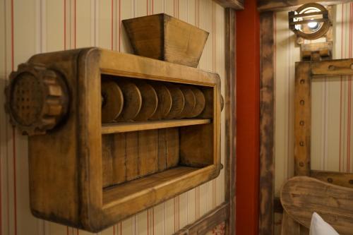 a wooden cabinet hanging on a wall at Aparthotel MyCologne in Cologne