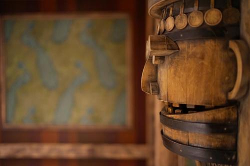 a wooden object on a wall with a map at Aparthotel MyCologne in Cologne