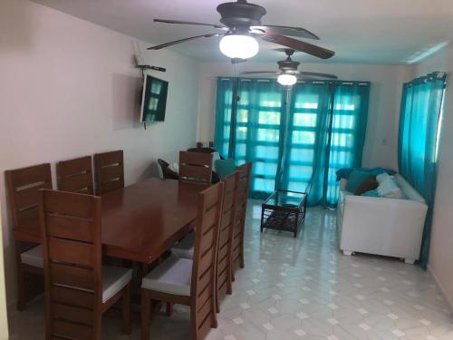 a dining room with a table and chairs at La Gaviota A3 in Juan Dolio