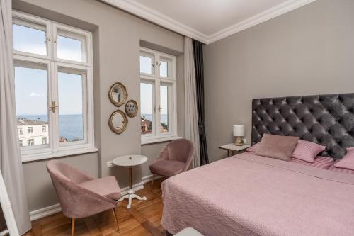Posteľ alebo postele v izbe v ubytovaní Luxury Peitho Residence