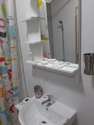 a bathroom with a sink and a mirror at DORIN COLINA MAREI in Sinaia