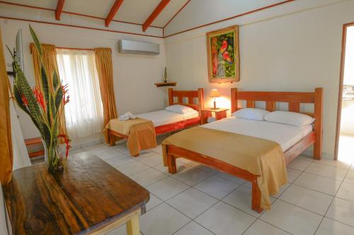 Postel nebo postele na pokoji v ubytování Hotel Cerro Lodge
