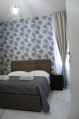 Кровать или кровати в номере Domus Suite
