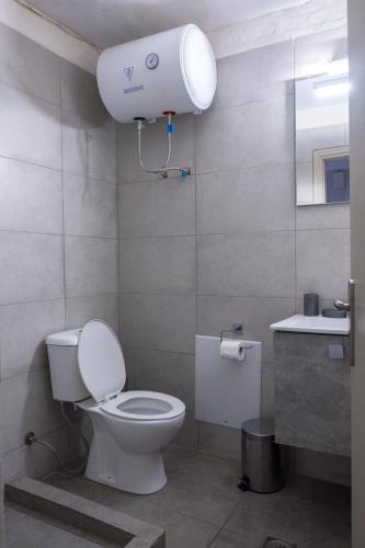 a bathroom with a toilet and a sink at Mary's room in Samos
