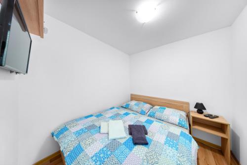Кровать или кровати в номере PB Apartments