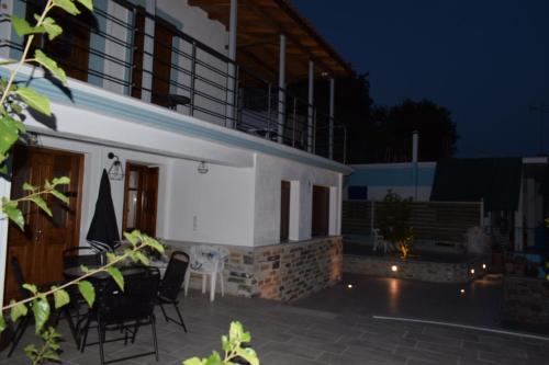 a patio of a house at night at Casa di levante - Glossa Skopelos in Loutraki
