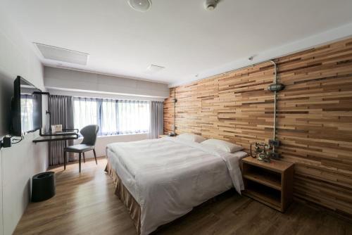Postel nebo postele na pokoji v ubytování RF Hotel - Zhongxiao