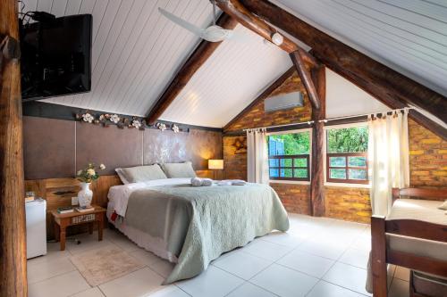 Tempat tidur dalam kamar di B & B Gourmet Itaipava