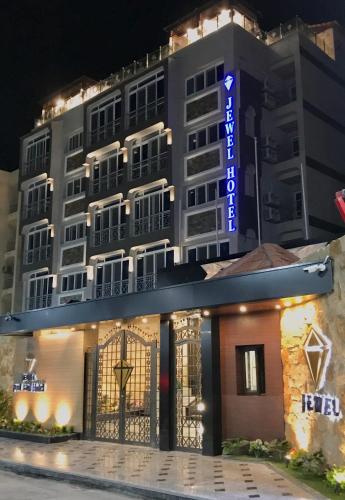 a hotel with a sign in front of it at Jewel Port Said Hotel in Port Said