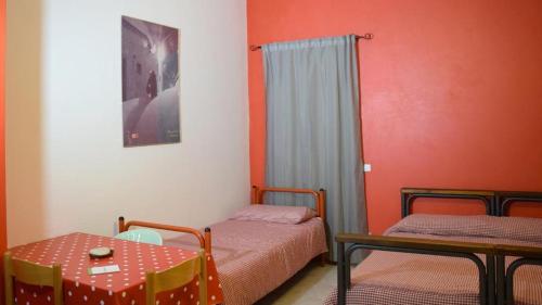 A bed or beds in a room at RIPARRUCCI nel Res Praetorium Maiella Park