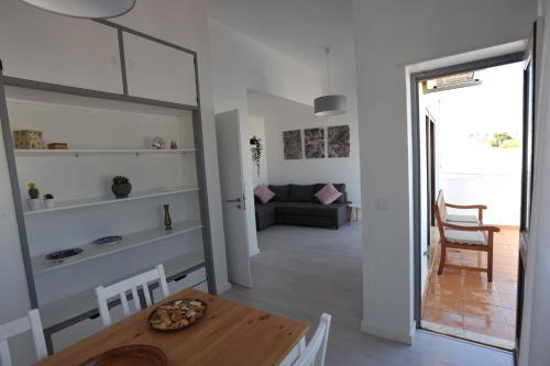a dining room and living room with a table at Lagos Central Apartments Ap 9 in Lagos