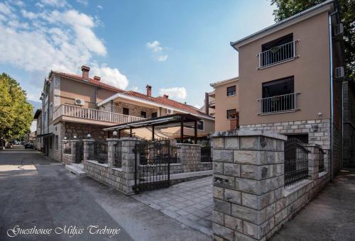 a large house with a fence in front of it at Smještaj Miljas Trebinje in Trebinje