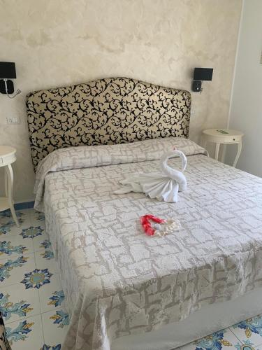 Кровать или кровати в номере Nonno Francesco B&B