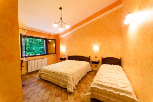 Un pat sau paturi într-o cameră la Vecchio Mulino