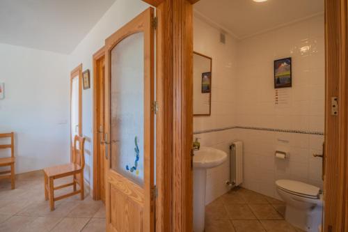 a bathroom with a toilet and a sink at G324 Vela 1 by Mallorca Villa Selection in Muro