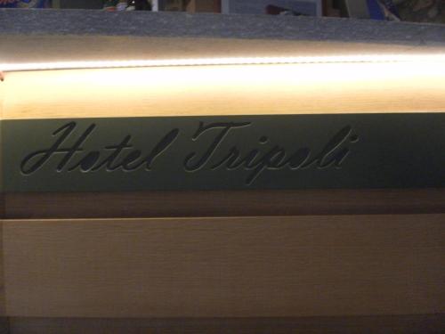 a wooden drawer with the name of a hotel trililli at Hotel Tripoli La Margherita in Limone Piemonte