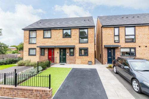 a brick house with a car parked in the driveway at Blackstone Walk - Fabulous Houses with Parking in Nottingham