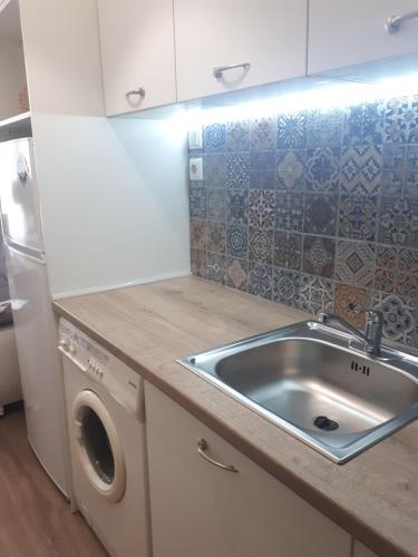 Η κουζίνα ή μικρή κουζίνα στο HostEx Meraki Apartment
