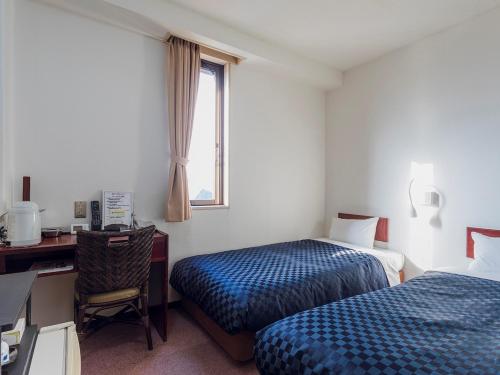 Postel nebo postele na pokoji v ubytování Matsue Urban Hotel Lake Inn