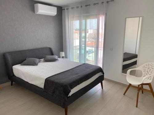 Un pat sau paturi într-o cameră la SOFISTICADO T2 MonteGordo