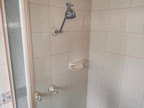 
a bathroom with a toilet and a shower curtain at Ballarat Eureka Lodge Motel in Ballarat
