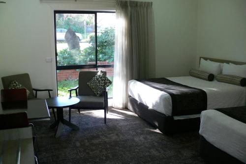 A bed or beds in a room at Springs Mittagong