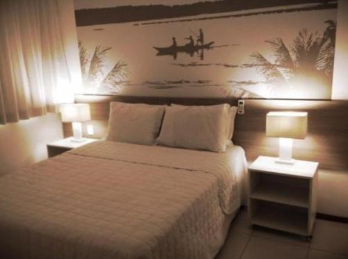 En eller flere senge i et værelse på Apartamento quarto e sala com varanda no ILOA Residence a 10 Km da Praia do Frances e 12 Km da Praia do Gunga