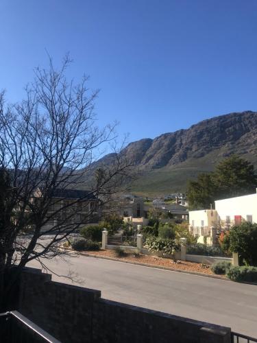 a view of a street with a mountain in the background at Comfortable Room with Large en suite Bathroom in Franschhoek