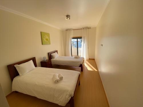 מיטה או מיטות בחדר ב-High quality T2 apartment In SMP