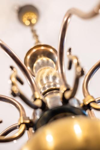 a close up of a metal chandelier at Villa Theresienhof in Rosegg