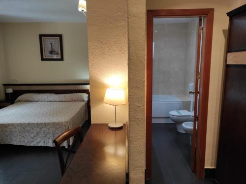 Ein Bett oder Betten in einem Zimmer der Unterkunft Hotel Prado Real