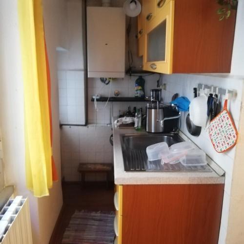 a small kitchen with a sink and a stove at nirvana in Genoa
