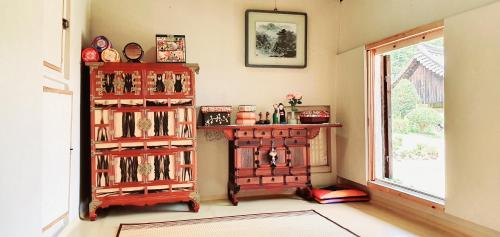 a room with two book shelves filled with books at Ahndong Kimjongtaek Yangsodang in Andong