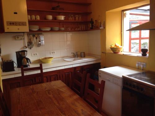 a kitchen with a sink and a counter top at El Drago Rural House in Alajeró