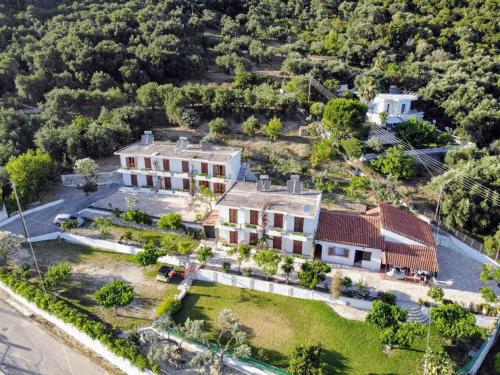 an aerial view of a large house with a yard at Theasea in Parga