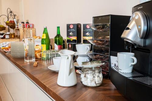 a kitchen counter with a coffee maker on it at Gästehaus Moßhammer in Graz