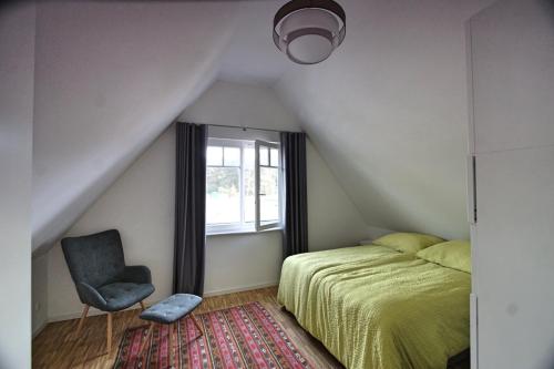 Postel nebo postele na pokoji v ubytování Haus unter den drei Bäumen - Urlaub auf der Sonneninsel Usedom