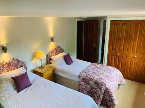 A bed or beds in a room at Sayang House 