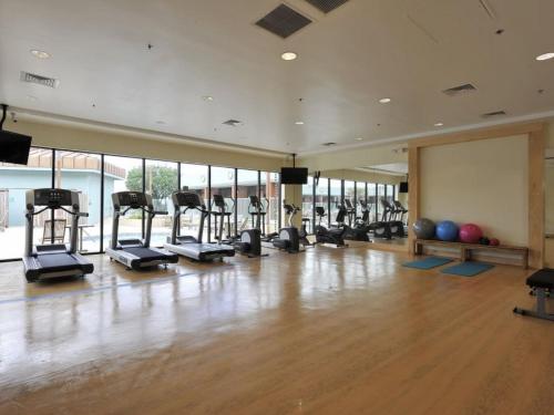 a gym with treadmills and exercise equipment in a room at Wyndham Garden Hotel Austin in Austin