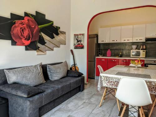 a living room with a couch and a table at Glorianita sweethome,centro, FREE parking,SELF CHECK- IN in Šibenik