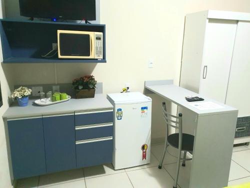 Η κουζίνα ή μικρή κουζίνα στο Acqua Flats Jaguariúna
