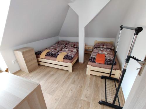 Postel nebo postele na pokoji v ubytování Apartmány Knížkovi